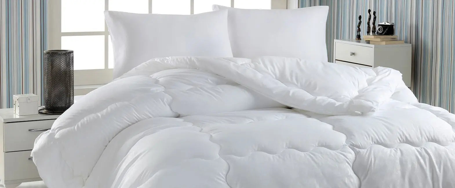 The Art of Layering: Mastering Bed Styling with Down Duvets and Elegant Pillow Arrangements