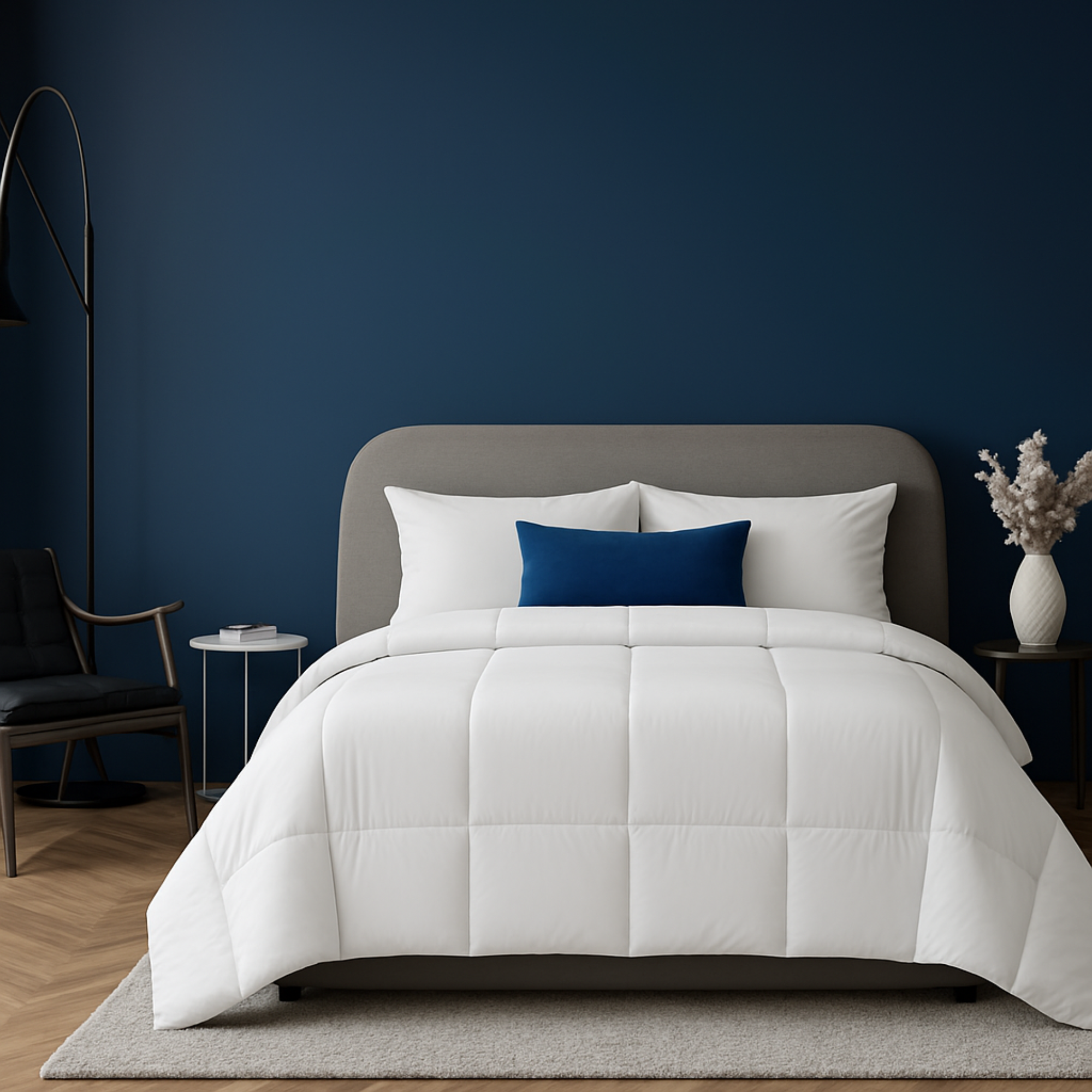 Royal Elite Premium White Goose Feather & Down Duvet styled on a modern bed in a navy blue bedroom with white pillows and a blue accent cushion.