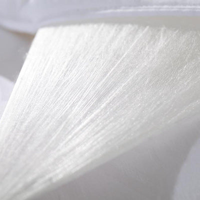 Layer of Mulberry Silk floss pulled back from the shell, showing the fine hand-layered fibres inside.