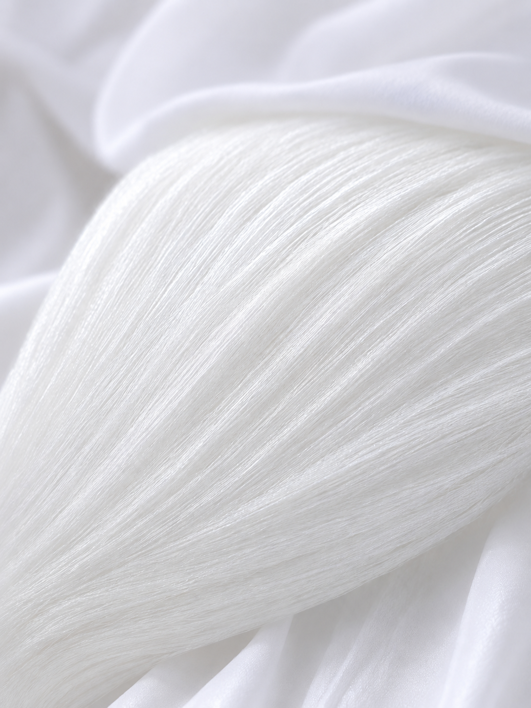 Close-up of bamboo viscose filling used in the Royal Elite Bamboo Pillow, showing its soft, silky fiber texture.