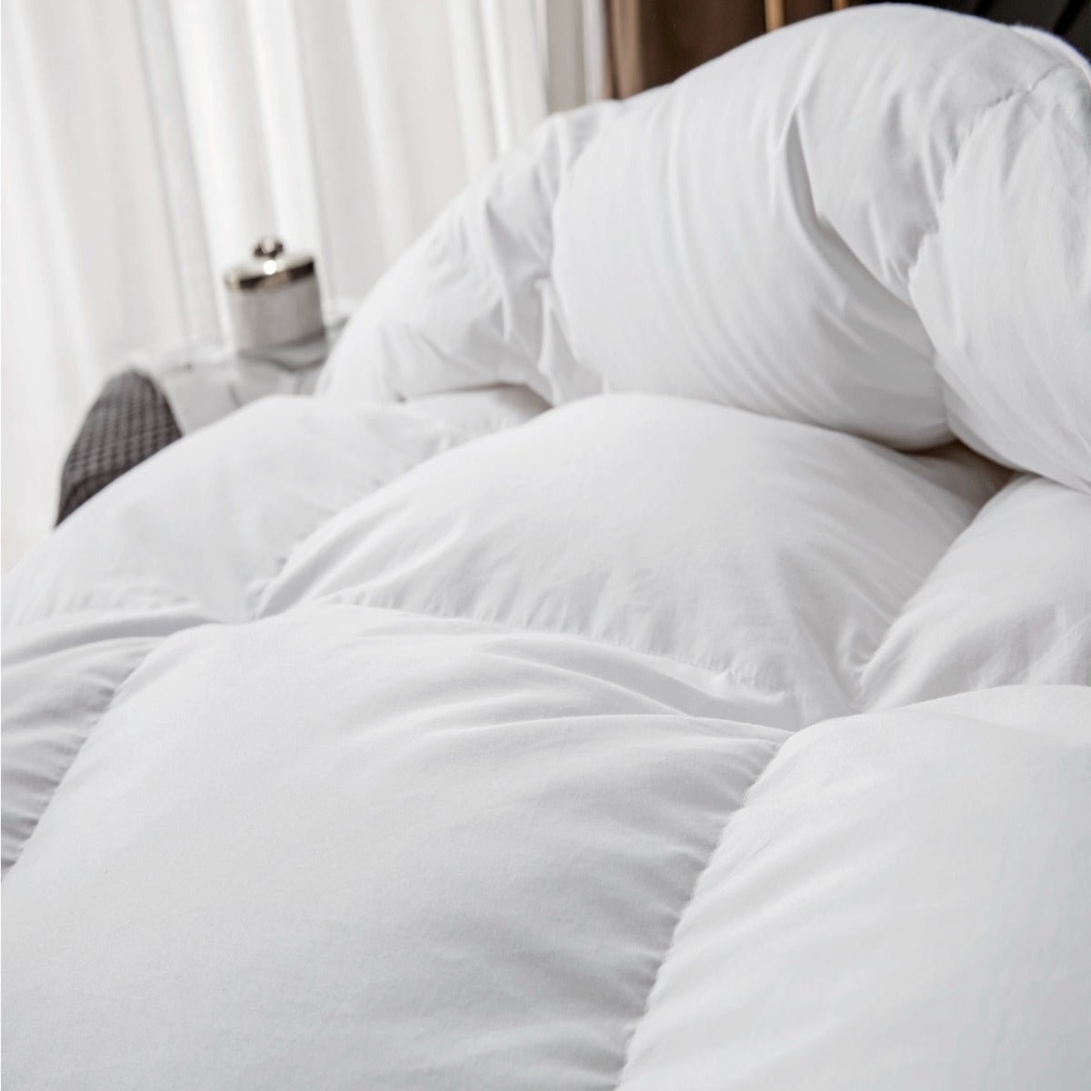 Royal Elite Canadian Hutterite White Goose Down Comforter showing how it is fluffy on bed. Cozy and warm. Cloud on bed.
