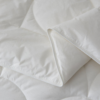 Close-up of the Royal Elite Feather & Down Duvet showing its smooth fabric, folded edge, and reinforced stitching.