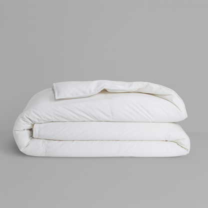 Royal Elite Feather & Down Duvet folded in white, showing its plush loft and quilted construction.