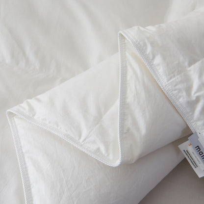 Close-up of the Royal Elite Feather Duvet showing its finished edges, reinforced stitching, and quilted construction details.
