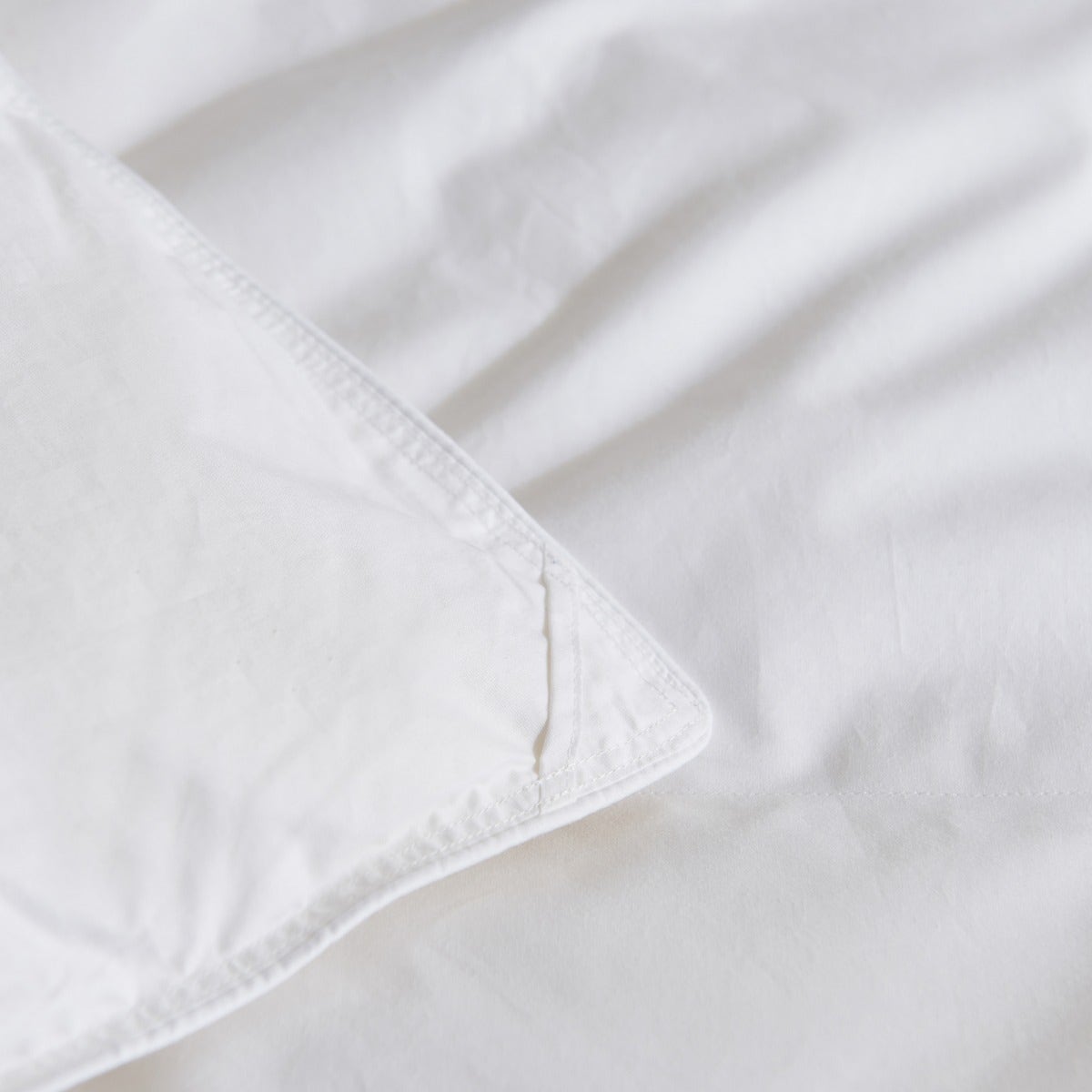 Close-up of one of four corner loops on the Royal Elite Feather Duvet for securing it inside a duvet cover.
