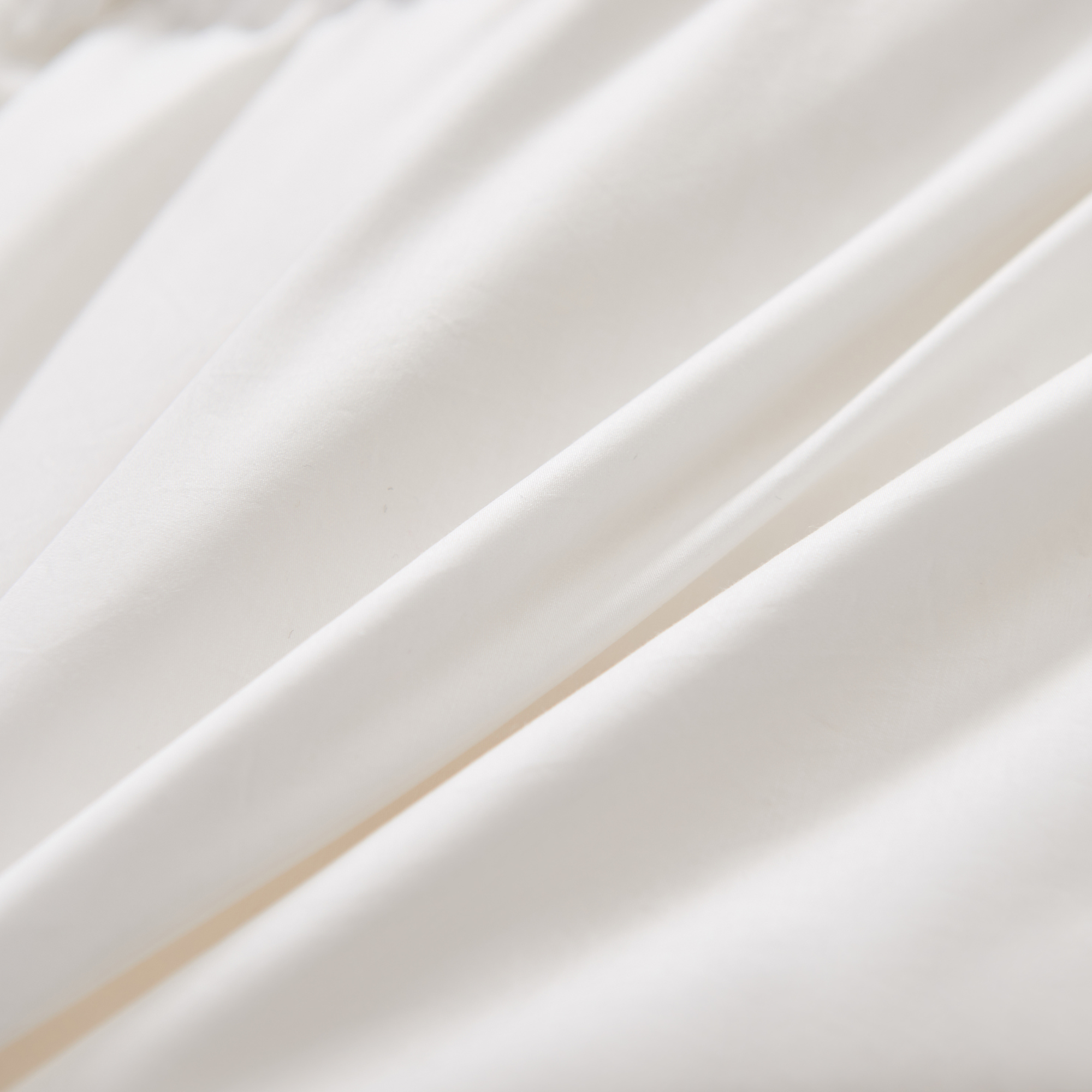 Close-up of Royal Elite Organic Cotton Sateen fabric sheet set. Premium quality and craftsmanship in Canada.
