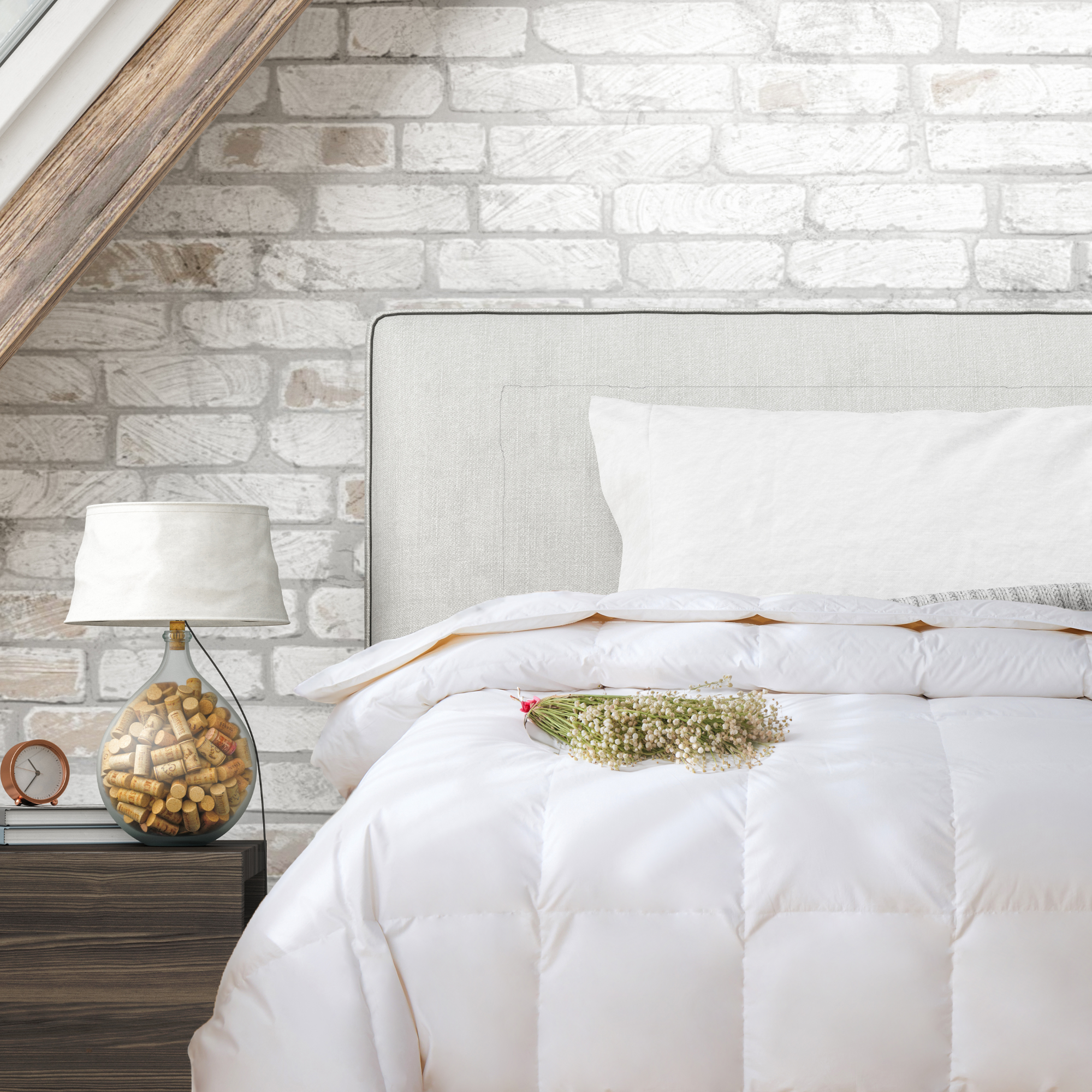 Royal Elite White Feather & Down Duvet styled on a queen bed with white bedding. Made in Canada.